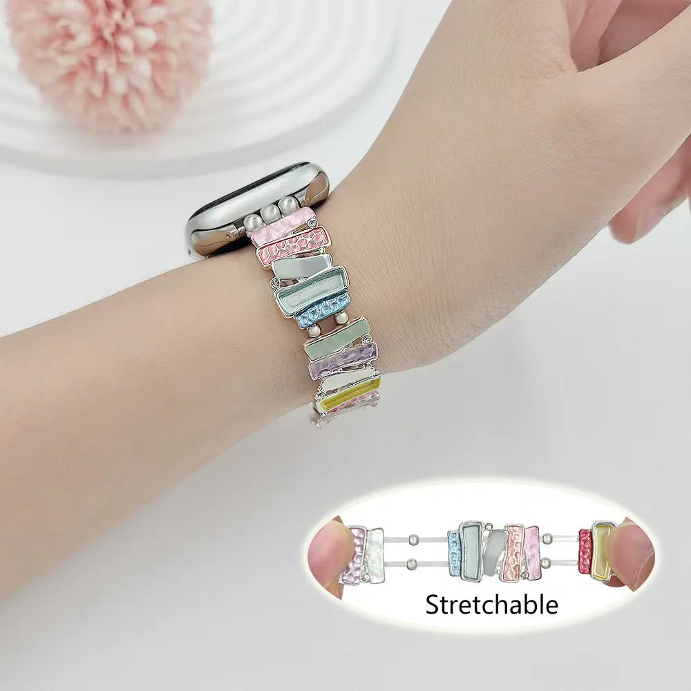 Multicolored stretchable bracelet on a wrist with a close-up inset showing the bracelet's flexibility.