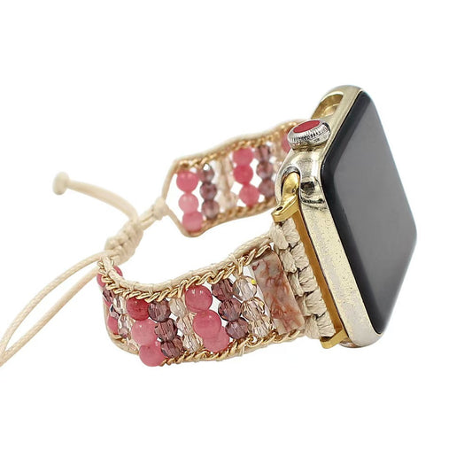 Smartwatch with a decorative pink beaded band on a white background