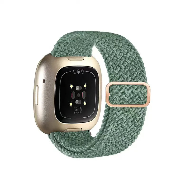 Smartwatch with a green braided band on a white background