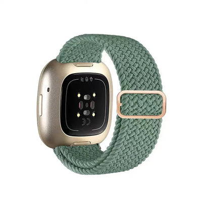 Smartwatch with a green braided band on a white background