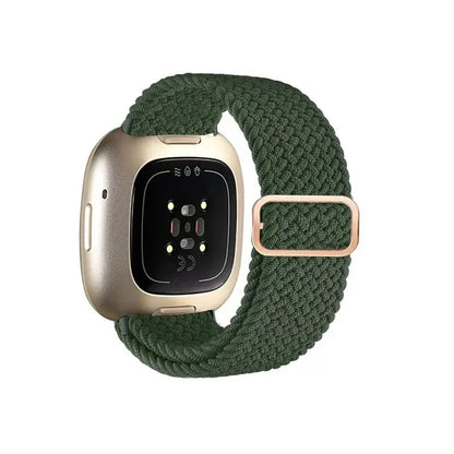 Smartwatch with a green braided band on a white background