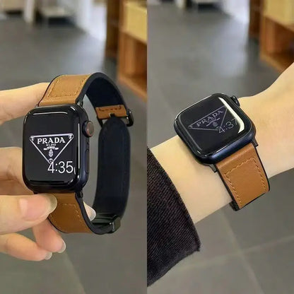 Two views of a Prada smartwatch with brown leather strap, one held in hand and one on wrist.