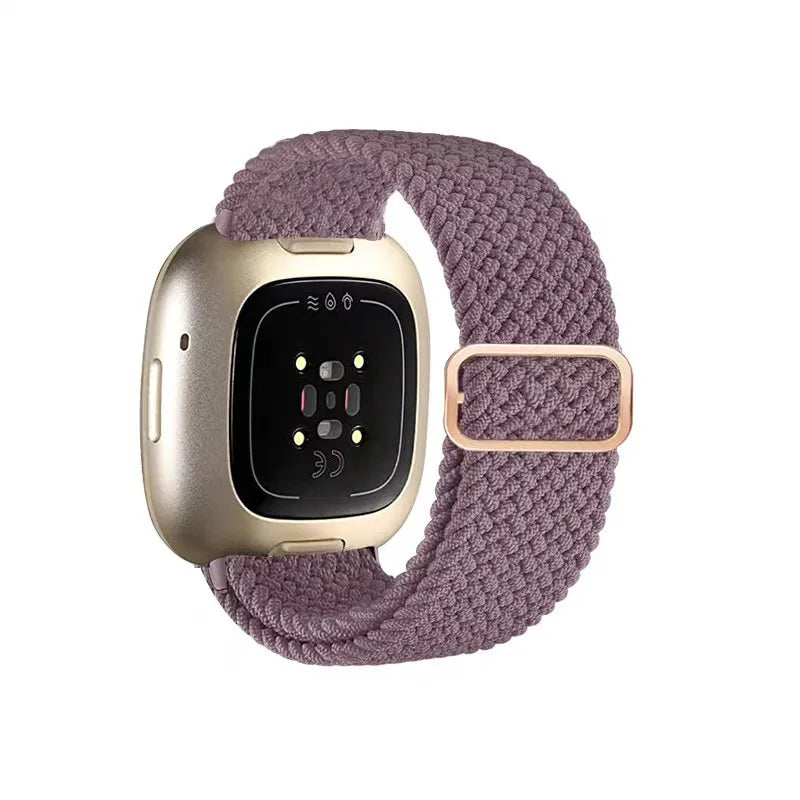 Smartwatch with a purple braided band on a white background