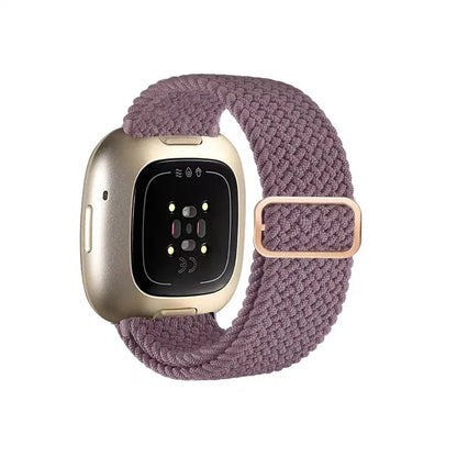 Smartwatch with a purple braided band on a white background