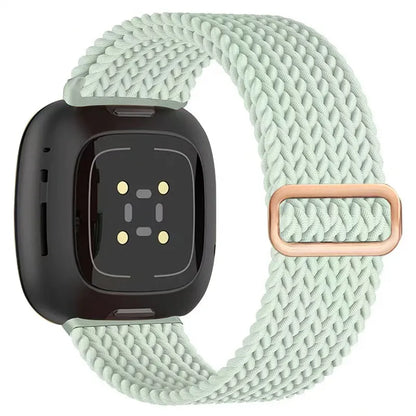 Smartwatch with a light green braided band on a white background