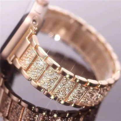 Close-up of a gold bracelet with diamond accents on a reflective surface.