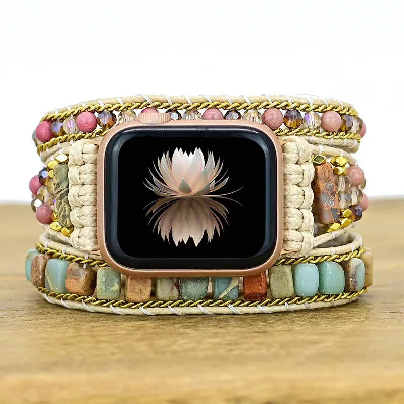 Smartwatch with a colorful beaded band on a wooden surface