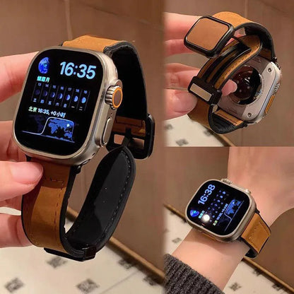 Smartwatch with brown leather strap held by a person, showing close-up details.