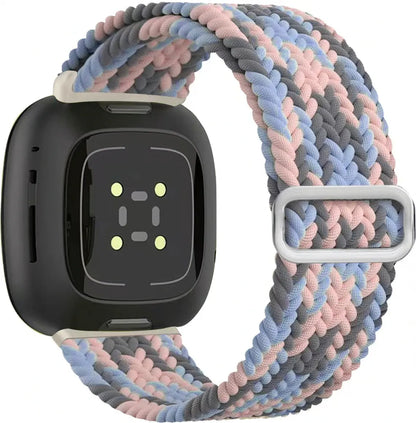 Fitness tracker with a colorful braided band on a white background