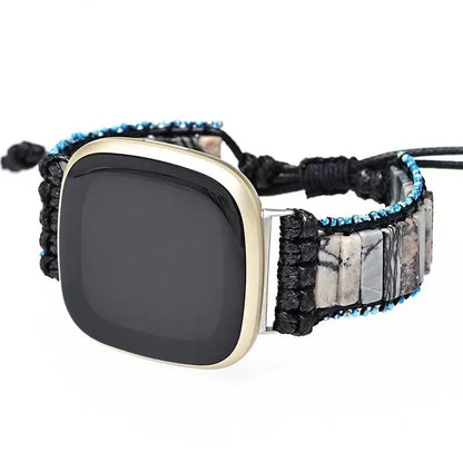 Smartwatch with a unique band featuring black, blue, and stone pattern on a white background