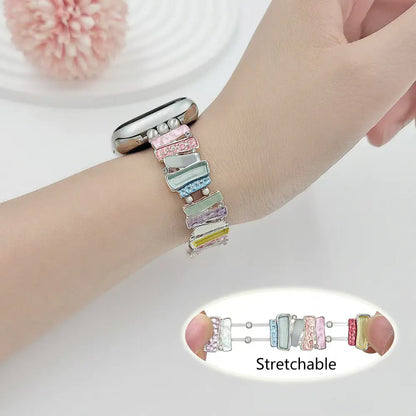 Multicolored stretchable bracelet on a wrist with a close-up inset showing the bracelet's flexibility.