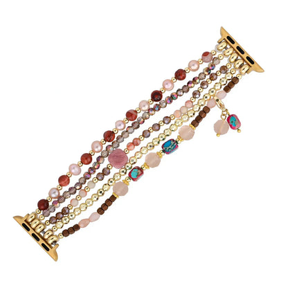 Multicolored beaded bracelet with gold accents on a white background