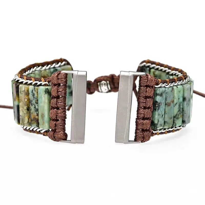 Bracelet with stone beads and metal clasp on a white background