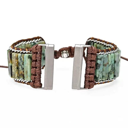 Bracelet with stone beads and metal clasp on a white background