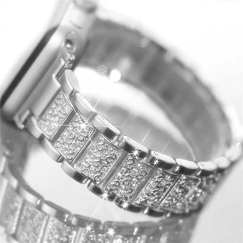 Close-up of a silver bracelet with diamond-like stones on a white background