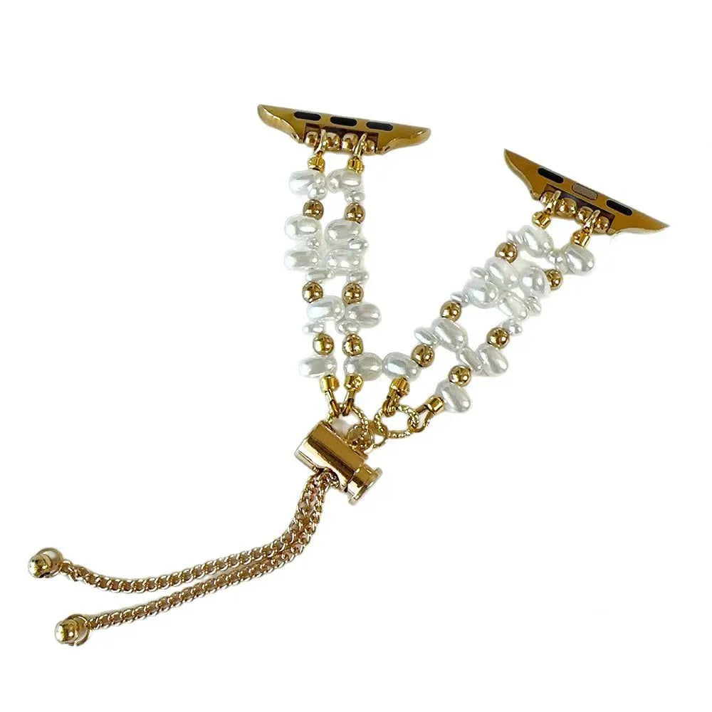 Gold and pearl bracelet on a white background