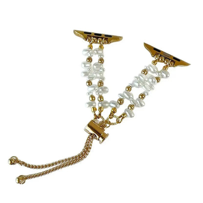 Gold and pearl bracelet on a white background