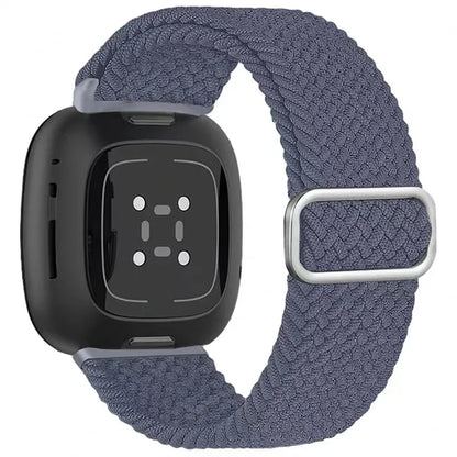 Black smartwatch with a blue woven band on a white background