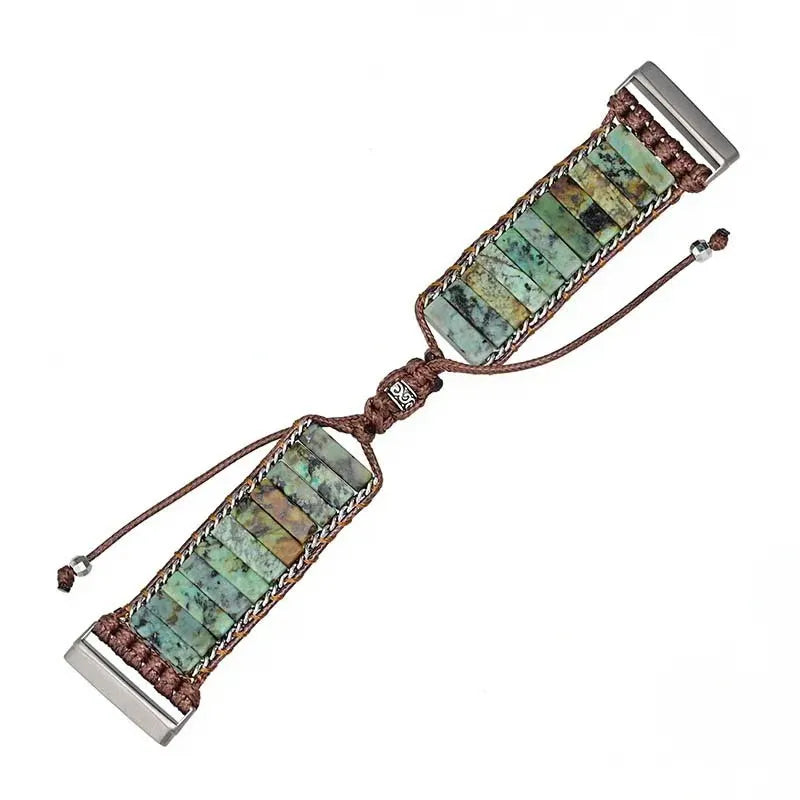 Bracelet with green stone beads and brown cord on a white background