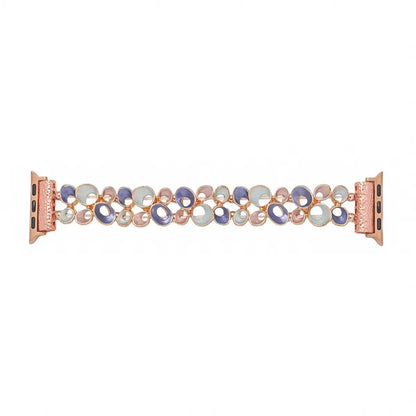 Multicolored watch band with rose gold clasp on a white background