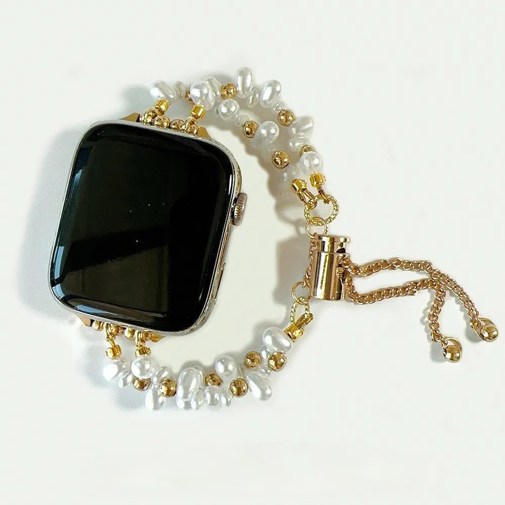 Smartwatch with a pearl and gold chain strap on a white background