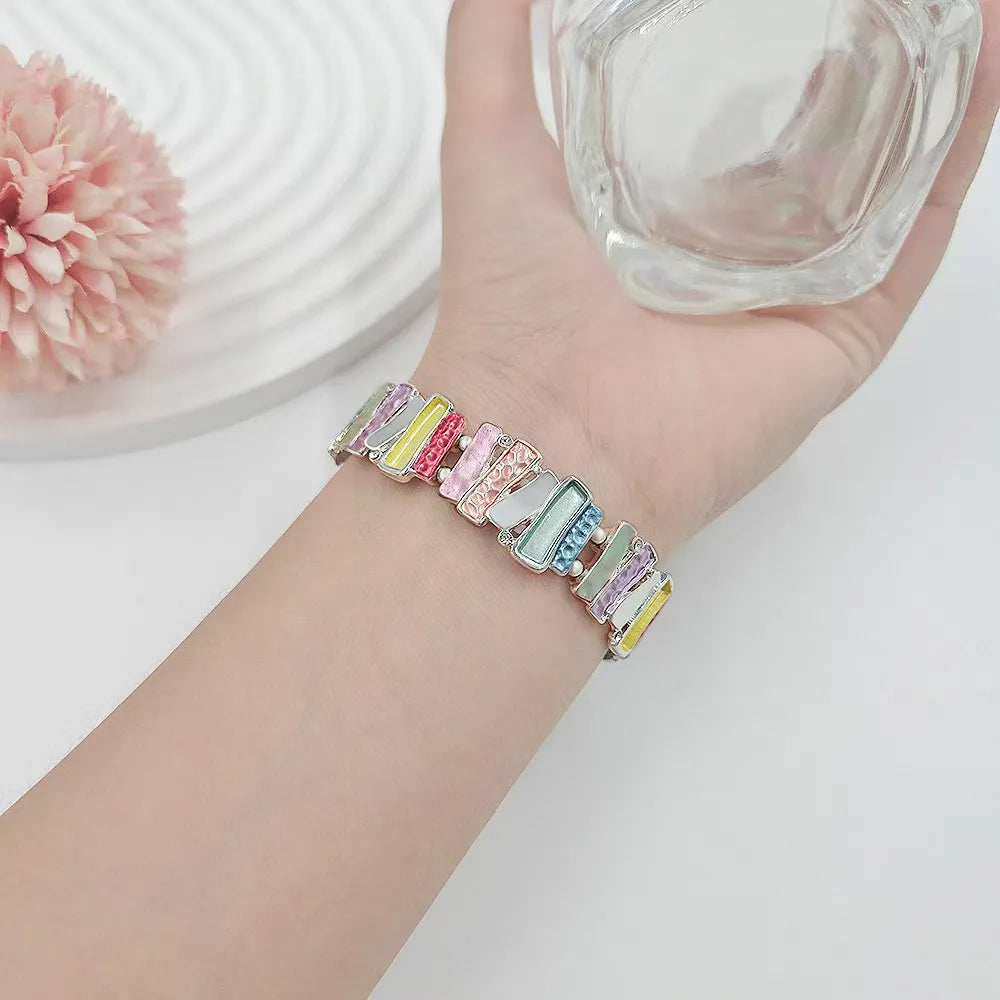 Multicolored bracelet on a wrist with a blurred background