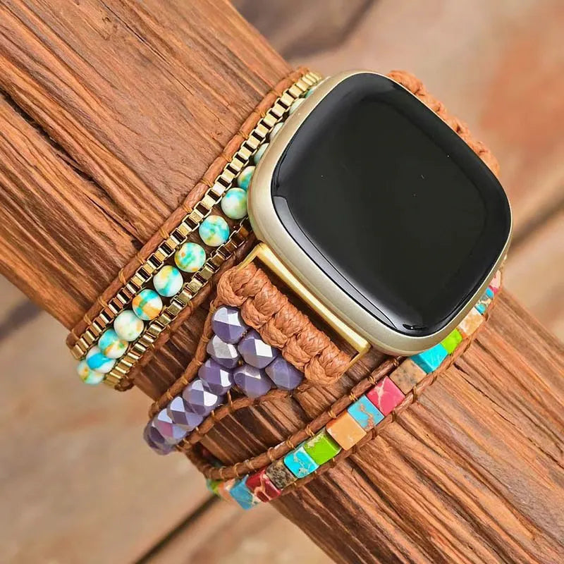 Smartwatch with a colorful beaded band on a wooden surface