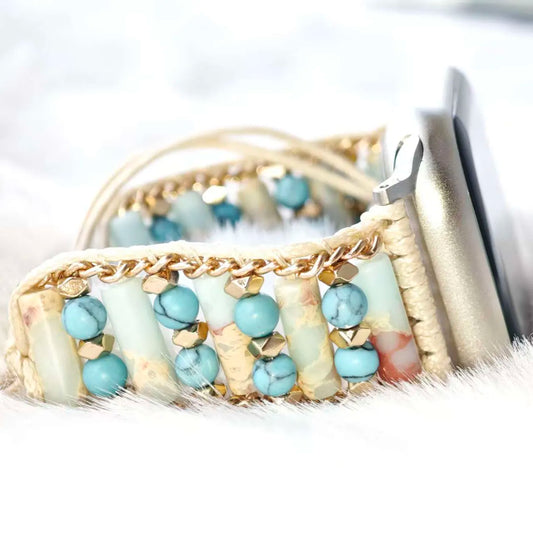 Woven basket with turquoise stones and gold chain on a white background