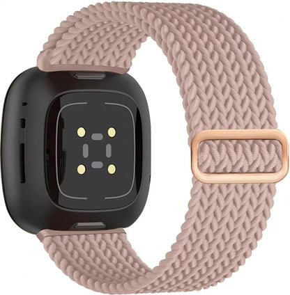 Smartwatch with a braided pink band on a white background