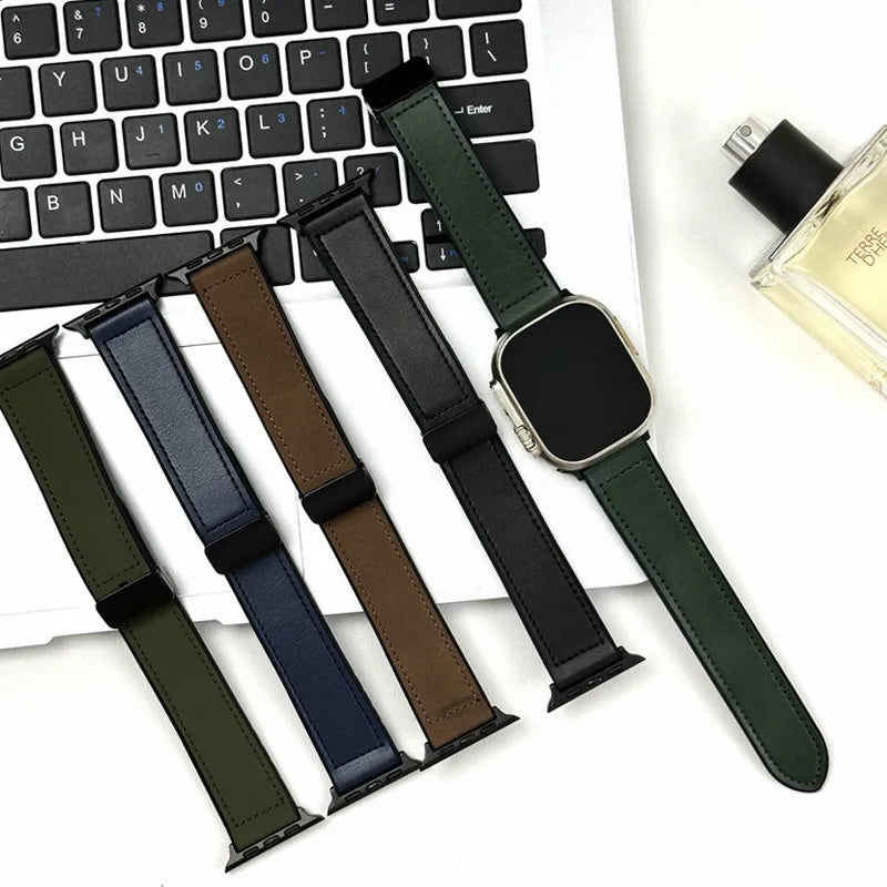 Set of watch straps in various colors on a keyboard