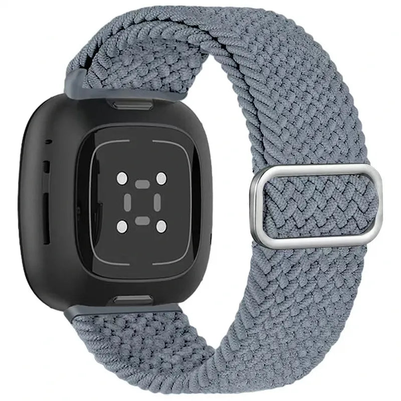 Black smartwatch with a gray woven band on a white background