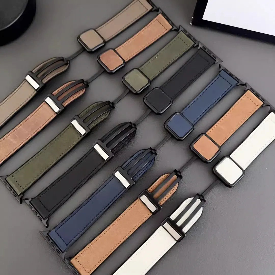 Collection of various watch straps in different colors on a gray surface.